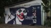 Kazakhstan - Nazarbayev's mural on a garage wall in Almaty was repainted portraying him as Joker.